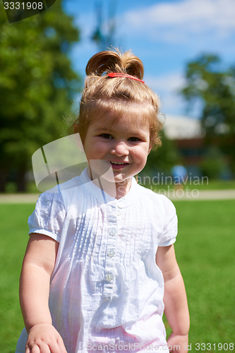 Image of little girl have fun in park