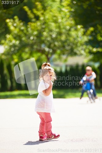 Image of little girl have fun in park