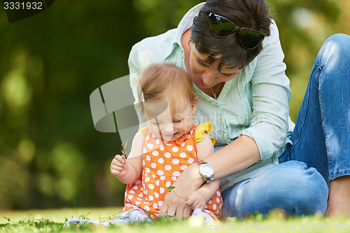 Image of mother and baby in park