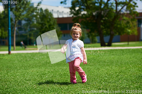 Image of little girl have fun in park