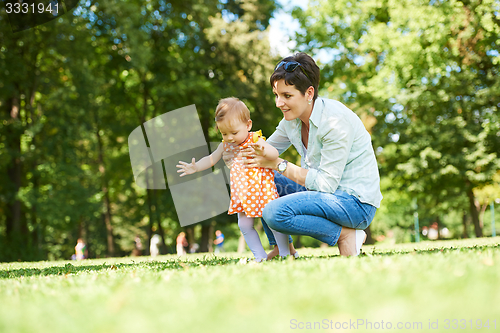 Image of mother and baby in park