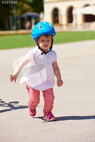 Image of little girl have fun in park