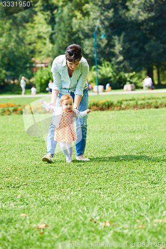 Image of mother and baby in park