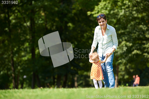 Image of mother and baby in park