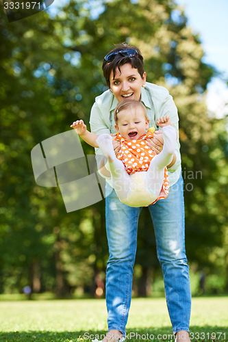 Image of mother and baby in park