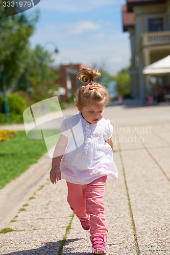 Image of little girl have fun in park