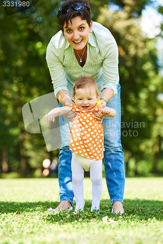 Image of mother and baby in park