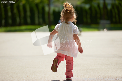 Image of little girl have fun in park