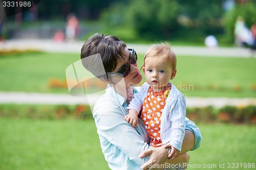 Image of mother and baby in park