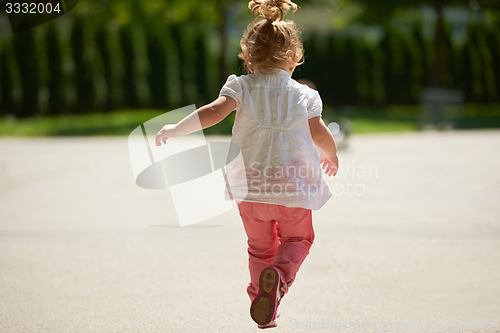 Image of little girl have fun in park