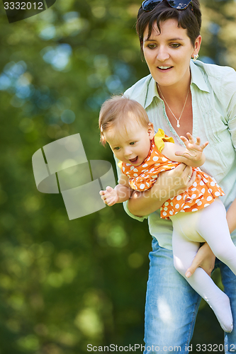 Image of mother and baby in park