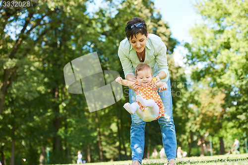 Image of mother and baby in park