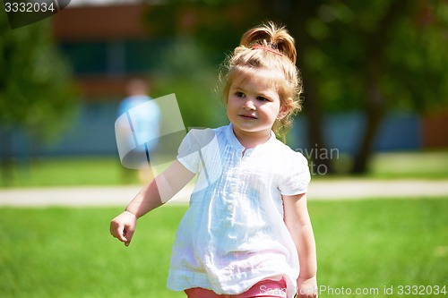 Image of little girl have fun in park