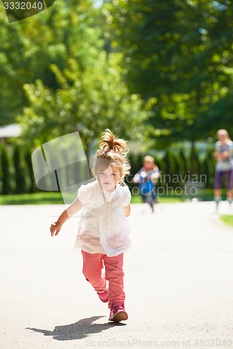 Image of little girl have fun in park