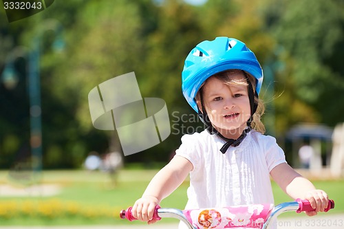 Image of little girl with bicycle