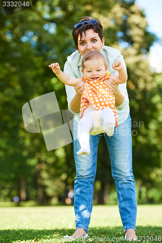 Image of mother and baby in park