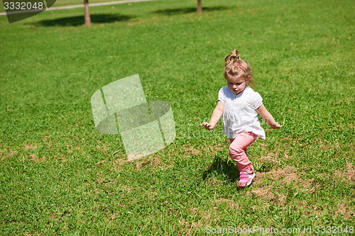 Image of little girl have fun in park