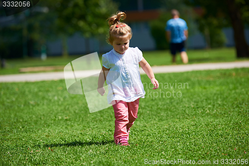 Image of little girl have fun in park