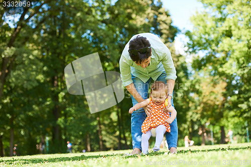 Image of mother and baby in park