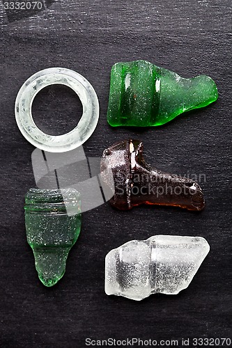 Image of collection of old sea glass bottlenecks 