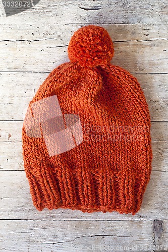 Image of wool orange pompom hat