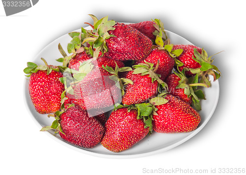 Image of Front and top pile of fresh strawberries on white plate