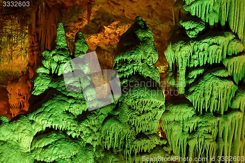 Image of Strange green-lit stalagmite shapes in Soreq Cave, Israel