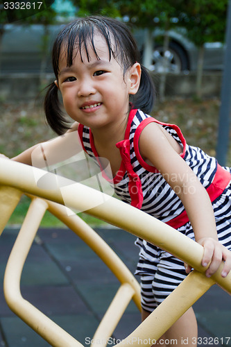 Image of Asian Kid Climbing