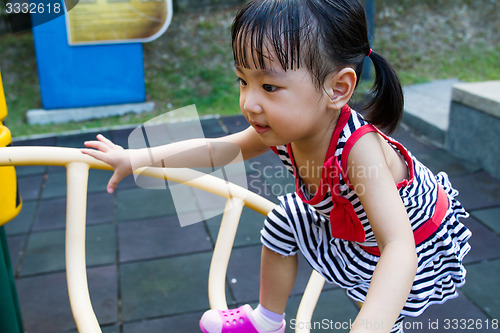 Image of Asian Kid Climbing