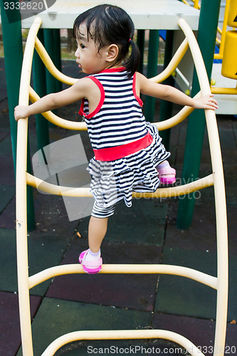 Image of Asian Kid Climbing