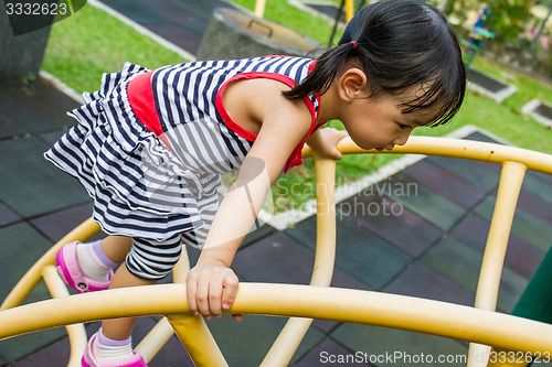 Image of Asian Kid Climbing