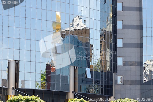 Image of One modern building reflection in another building 