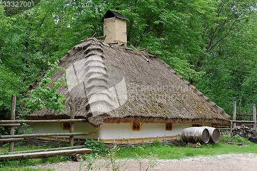 Image of Farmer's house under the thatch roof in open air museum, Kiev, Ukraine