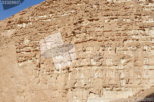 Image of Texture of an orange weathered rock in the desert