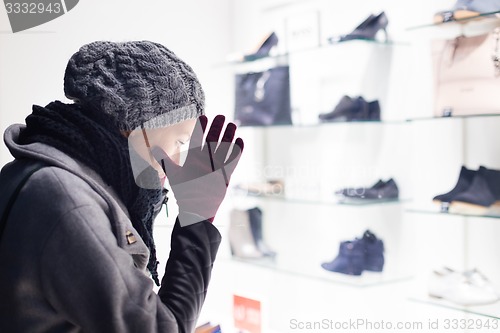 Image of Woman window shopping.