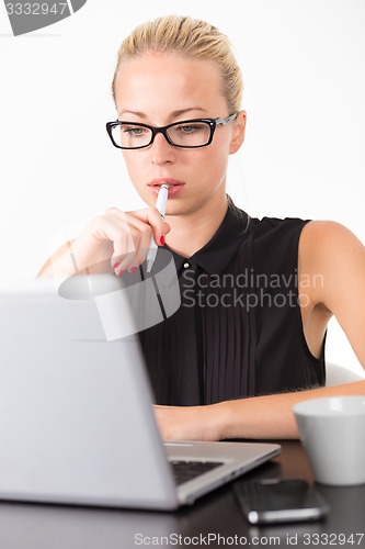 Image of Business woman in office.