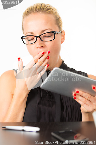 Image of Business woman yawning.