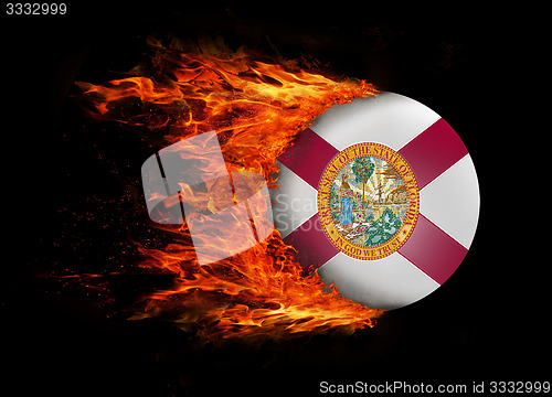 Image of US state flag with a trail of fire - Florida