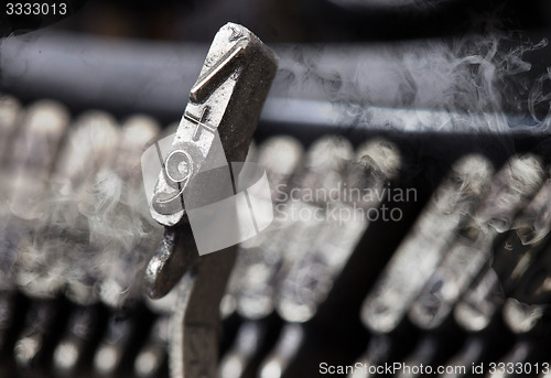 Image of 9 hammer - old manual typewriter - mystery smoke