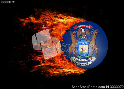 Image of US state flag with a trail of fire - Michigan