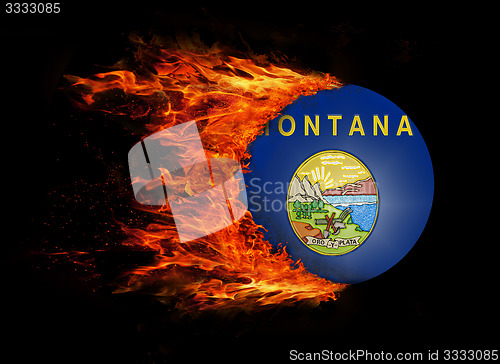 Image of US state flag with a trail of fire - Montana