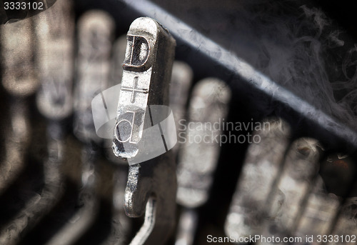 Image of D hammer - old manual typewriter - mystery smoke