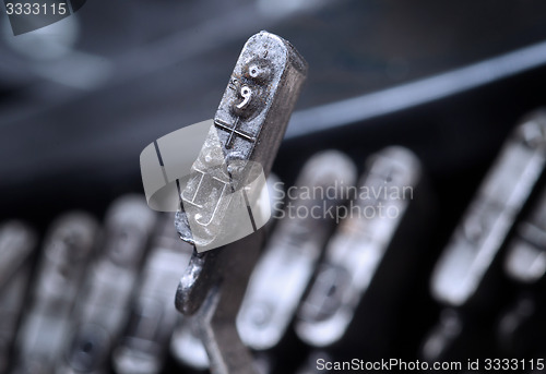 Image of IJ hammer - old manual typewriter - cold blue filter