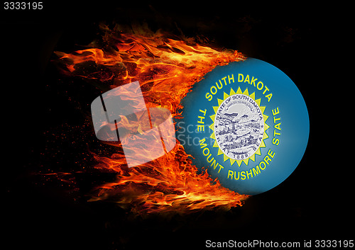 Image of US state flag with a trail of fire - South Dakota