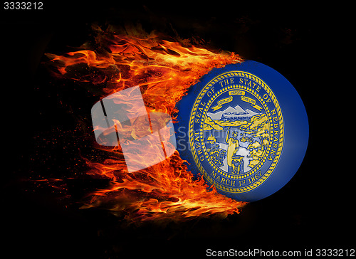 Image of US state flag with a trail of fire - Nebraska