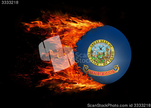 Image of US state flag with a trail of fire - Idaho