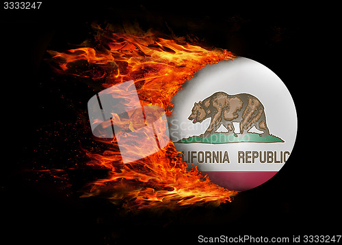 Image of US state flag with a trail of fire - California