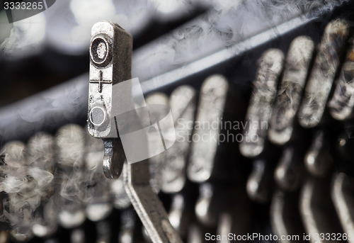Image of O hammer - old manual typewriter - mystery smoke