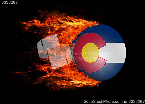 Image of US state flag with a trail of fire - Colorado