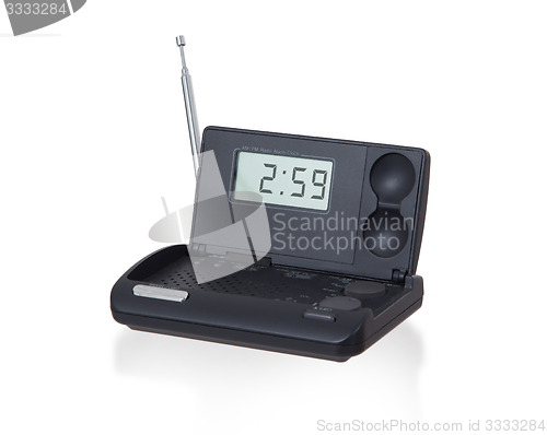 Image of Old digital radio alarm clock isolated on white